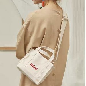 Like New Mini black cotton crossbody bag